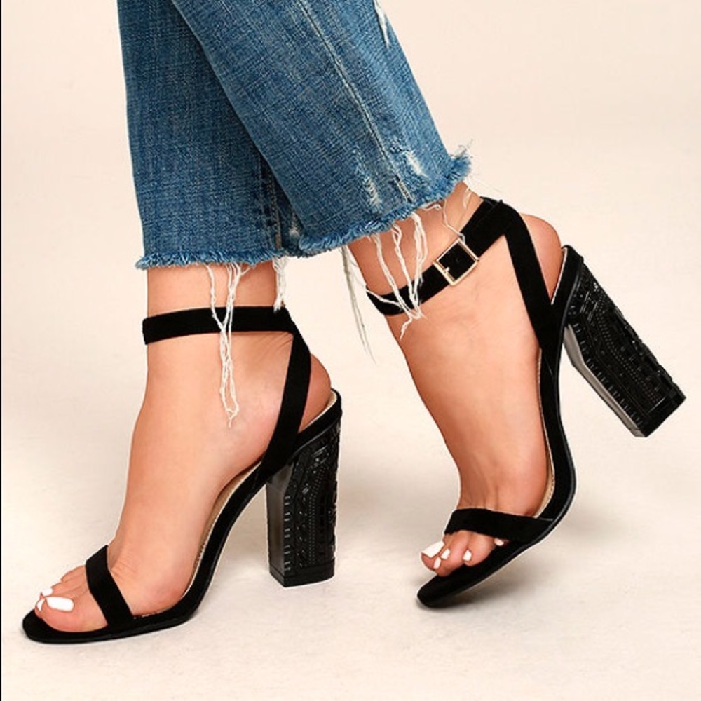 Black suede ankle strap heels with engraved heel